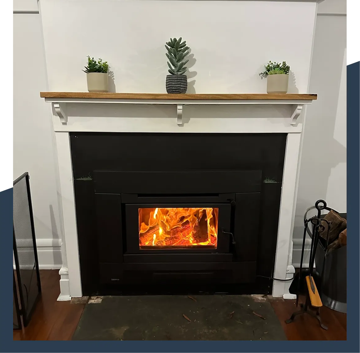 A fireplace with fire burning in it.